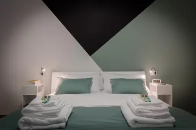 Letto o letti in una camera di Maggie House