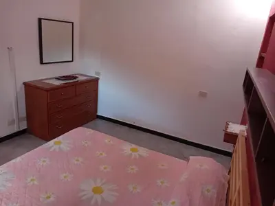 Letto o letti in una camera di Casa Gioele