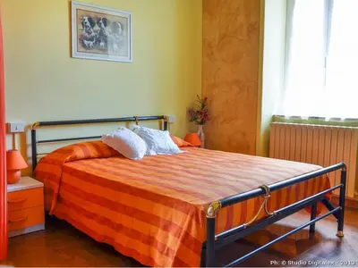 Letto o letti in una camera di Casa Vacanze Nonna Nella
