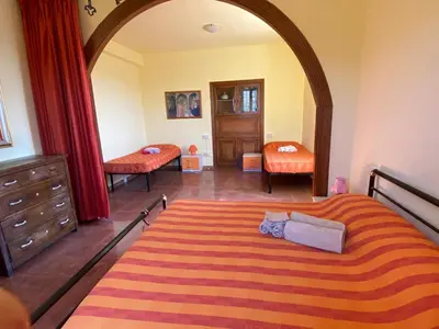Letto o letti in una camera di Casa Vacanze Nonna Nella