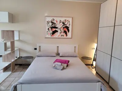 Letto o letti in una camera di Belgioioso Apartments - Monolocale