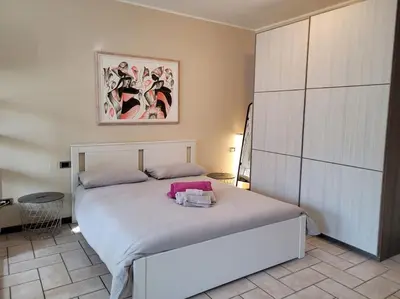 Letto o letti in una camera di Belgioioso Apartments - Monolocale