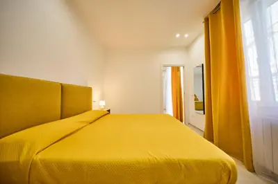 Letto o letti in una camera di Appartamento Umberto
