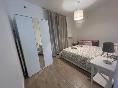 Letto o letti in una camera di Il Centro Apartments-Salsomaggiore Terme