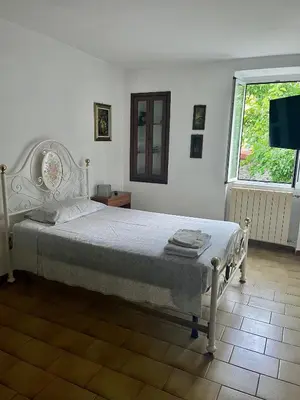 Letto o letti in una camera di Casa Gio'