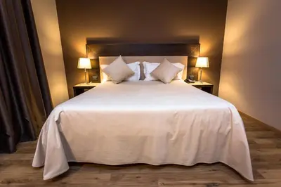 Letto o letti in una camera di HOTEL DON CAMILLO