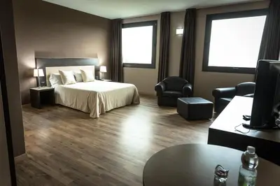 Letto o letti in una camera di HOTEL DON CAMILLO