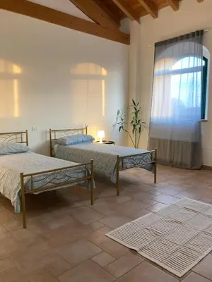 Letto o letti in una camera di Locanda Bistrot Zia Nena