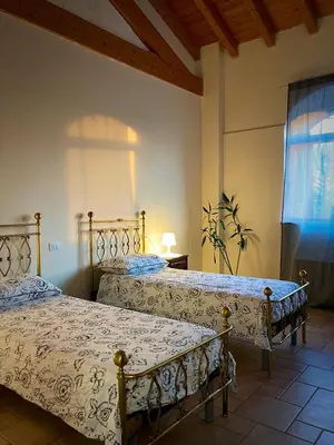 Letto o letti in una camera di Locanda Bistrot Zia Nena