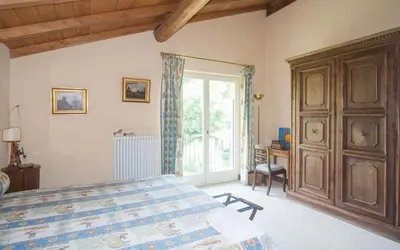 Letto o letti in una camera di Villa Monia
