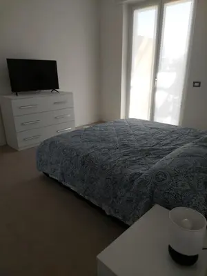 Letto o letti in una camera di Residenza S.Ambrogio