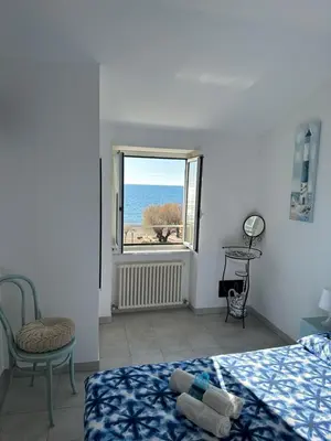 Letto o letti in una camera di Perla Marina
