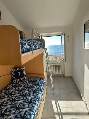 Letto o letti in una camera di Perla Marina