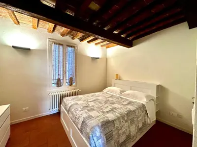 Letto o letti in una camera di Home 28 appartamento nel cuore di Modena centro