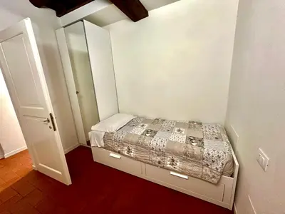 Letto o letti in una camera di Home 28 appartamento nel cuore di Modena centro