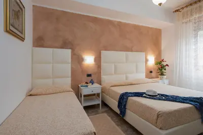 Letto o letti in una camera di Kriss Apartments