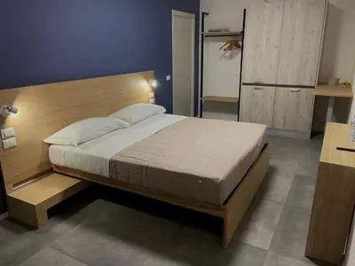 Letto o letti in una camera di Dormi-RE Affittacamere