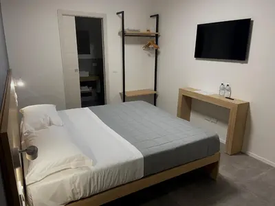 Letto o letti in una camera di Dormi-RE Affittacamere