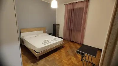 Letto o letti in una camera di villa Archimede