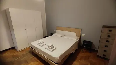 Letto o letti in una camera di villa Archimede