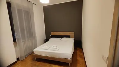 Letto o letti in una camera di villa Archimede
