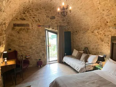 Letto o letti in una camera di La Casa Medievale Suites e SPA