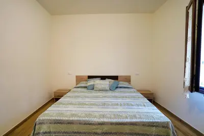 Letto o letti in una camera di Cà Mandarein