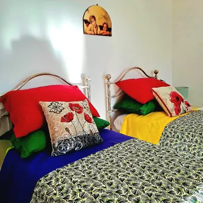 Letto o letti in una camera di Casa Vacanze PetFriendly tra i Vigneti