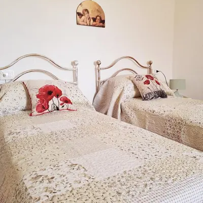 Letto o letti in una camera di Casa Vacanze PetFriendly tra i Vigneti
