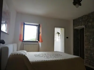 Letto o letti in una camera di La Debbia Ranch
