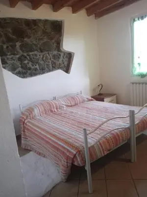 Letto o letti in una camera di La Debbia Ranch