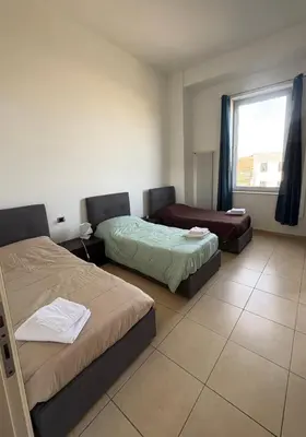 Letto o letti in una camera di Affittacamere Ami