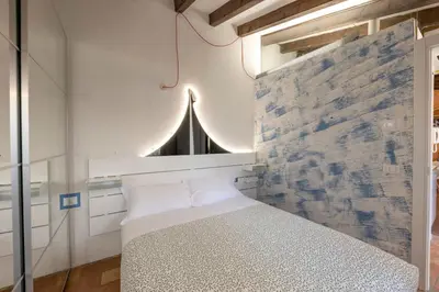 Letto o letti in una camera di Antica legnaia - vita all'aperto in centro storico