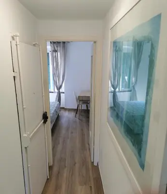 Letto o letti in una camera di VERDEACQUA Flat