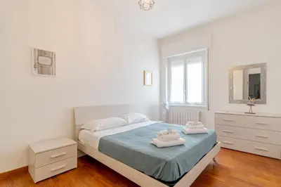 Letto o letti in una camera di GuestHost - Castagneto Holiday & Relax Apartment