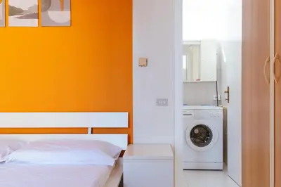 Letto o letti in una camera di peach apartment