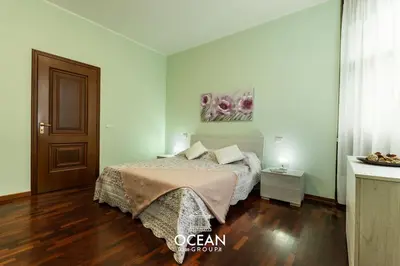 Letto o letti in una camera di Spaziosa Casa con parcheggio OceanGroupApartments