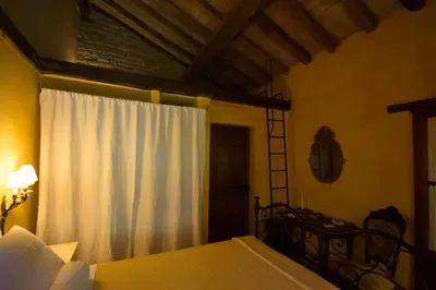 Letto o letti in una camera di Locanda dei Melograni
