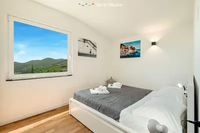 Letto o letti in una camera di Reborn House, TerreMarine