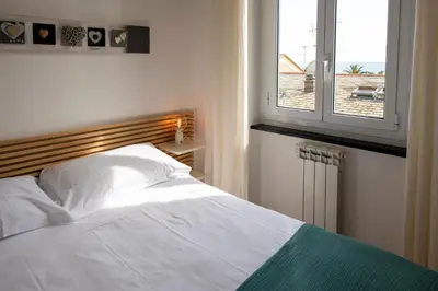 Letto o letti in una camera di Appartamento il Caruggio