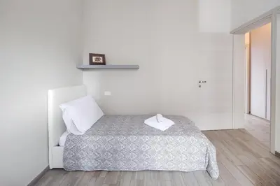 Letto o letti in una camera di Santa Caterina - Nel Cuore di Crema