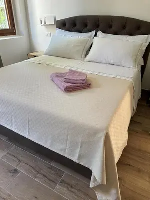 Letto o letti in una camera di Il Glicine