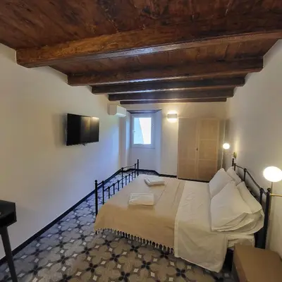 Letto o letti in una camera di La Posta Apartment