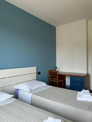 Letto o letti in una camera di B&B Gioia