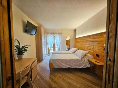 Letto o letti in una camera di La Genzianella affittacamere