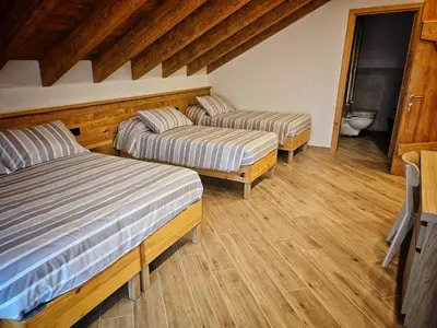 Letto o letti in una camera di La Genzianella affittacamere