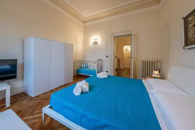 Letto o letti in una camera di RAPALLO BEACH HOUSE A due passi dal mare
