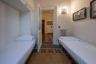 Letto o letti in una camera di RAPALLO BEACH HOUSE A due passi dal mare