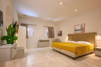 Letto o letti in una camera di San Giuseppe Apartments
