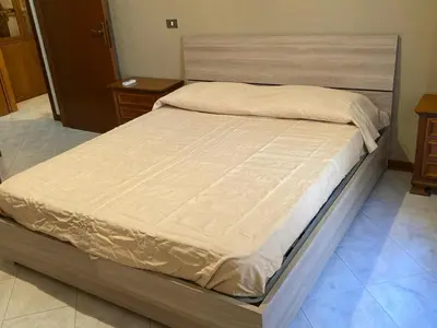 Letto o letti in una camera di Loft via Jesi a Correggio